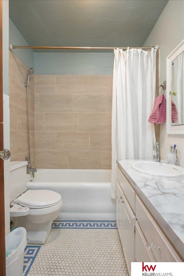 full bathroom featuring vanity, toilet, and shower / bath combo with shower curtain