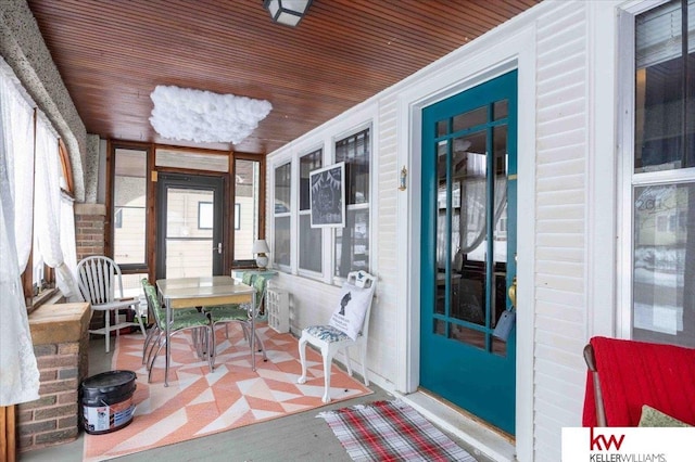 sunroom / solarium with wood ceiling