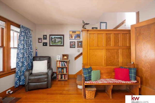 sitting room featuring plenty of natural light and wood-type flooring