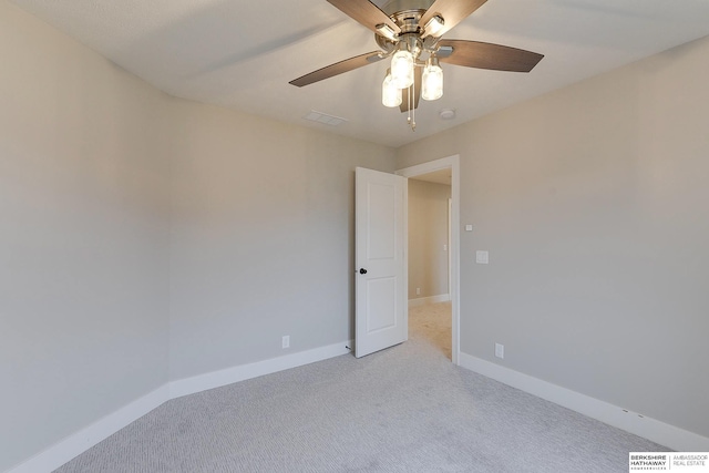 carpeted empty room with ceiling fan