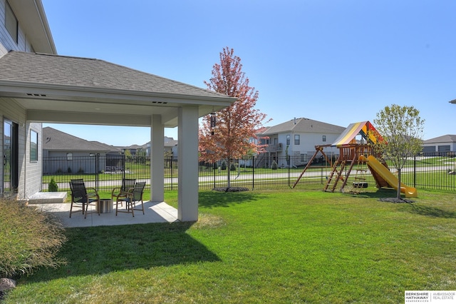 view of yard with a patio and a playground