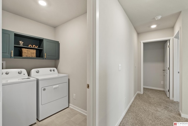 laundry area with cabinets, light colored carpet, and independent washer and dryer