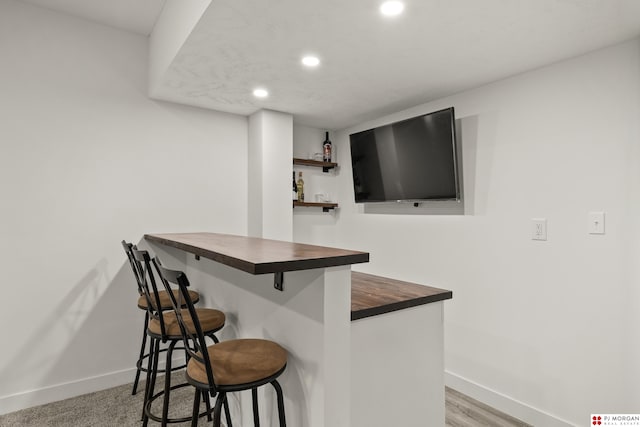 bar featuring butcher block countertops