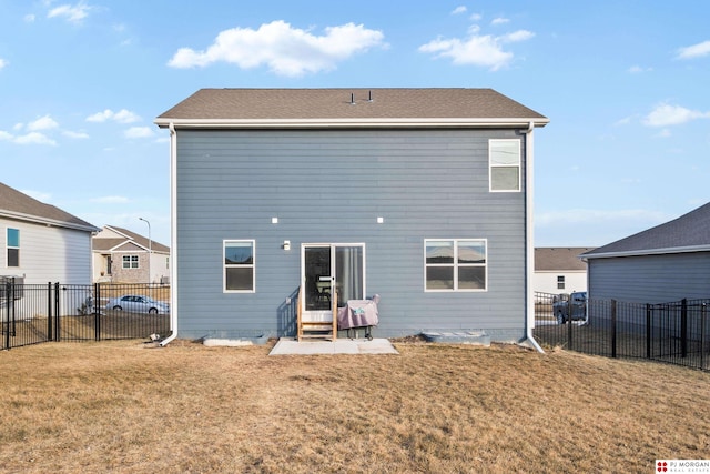 rear view of house with a lawn