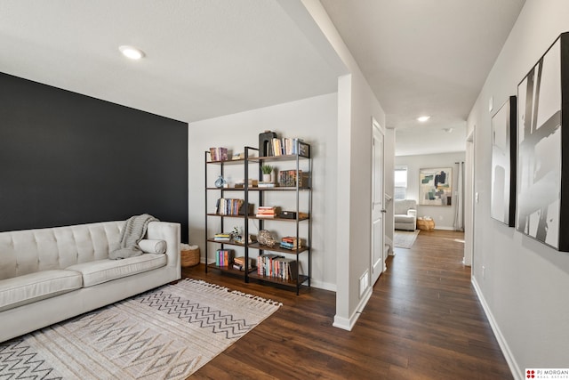 living room featuring dark wood-type flooring