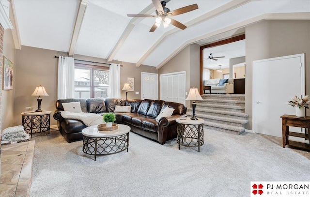 carpeted living room featuring ceiling fan and lofted ceiling with beams