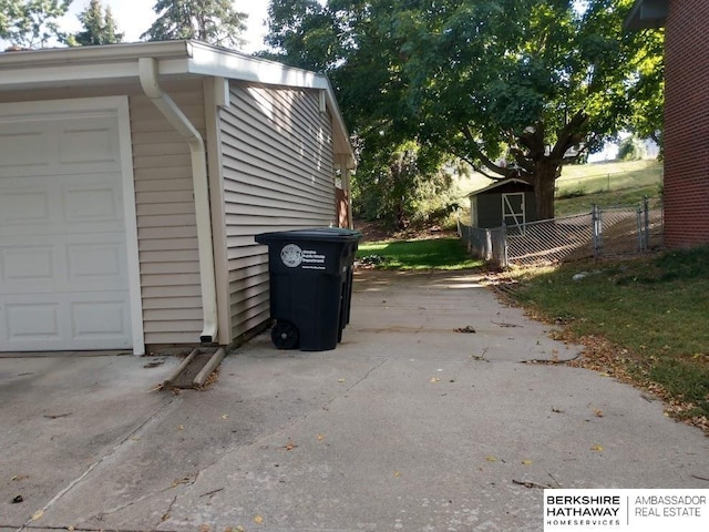 view of side of property featuring an outbuilding