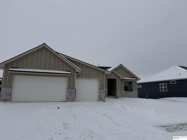 view of front of property with board and batten siding and a garage