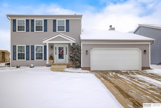 view of front of property featuring a garage