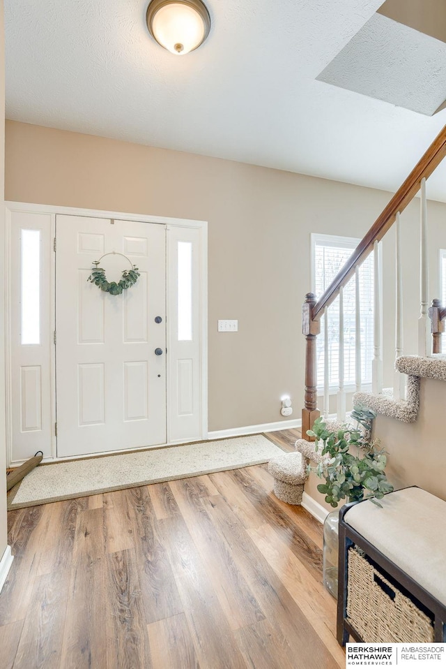 foyer entrance featuring light hardwood / wood-style flooring