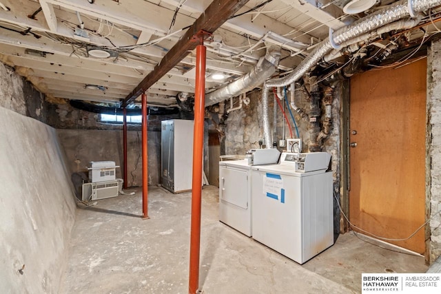 basement with washer and clothes dryer