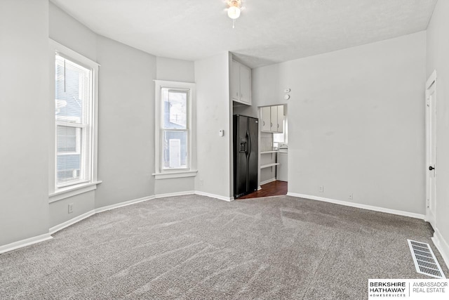 unfurnished living room with carpet