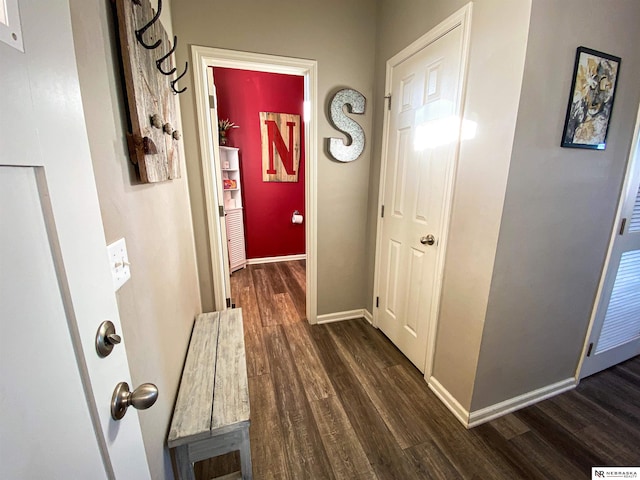 corridor featuring dark hardwood / wood-style floors