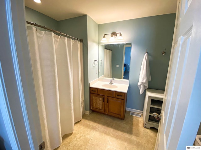 bathroom with vanity and tile patterned flooring