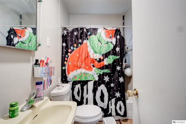 bathroom with sink and toilet