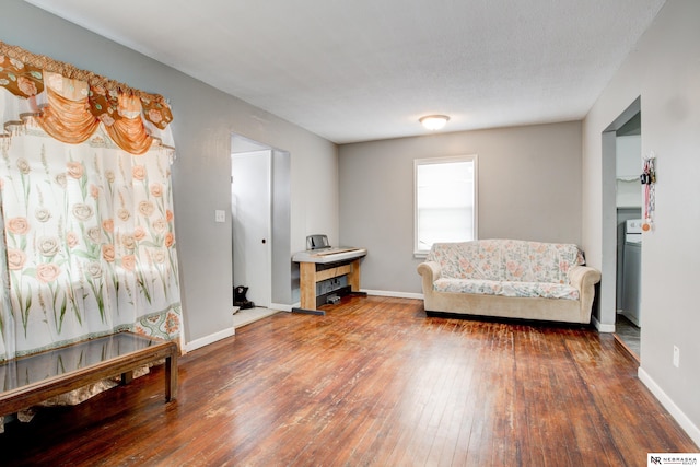 sitting room with a textured ceiling and hardwood / wood-style floors