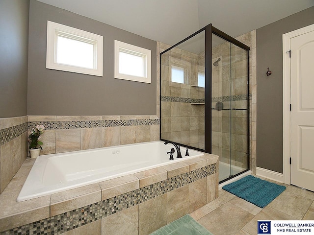 bathroom with tile patterned flooring and independent shower and bath