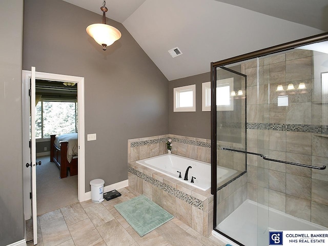 bathroom featuring vaulted ceiling and shower with separate bathtub