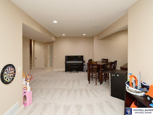 view of carpeted dining space