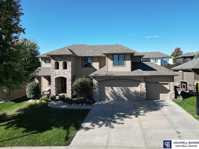 prairie-style house with a garage and a front lawn