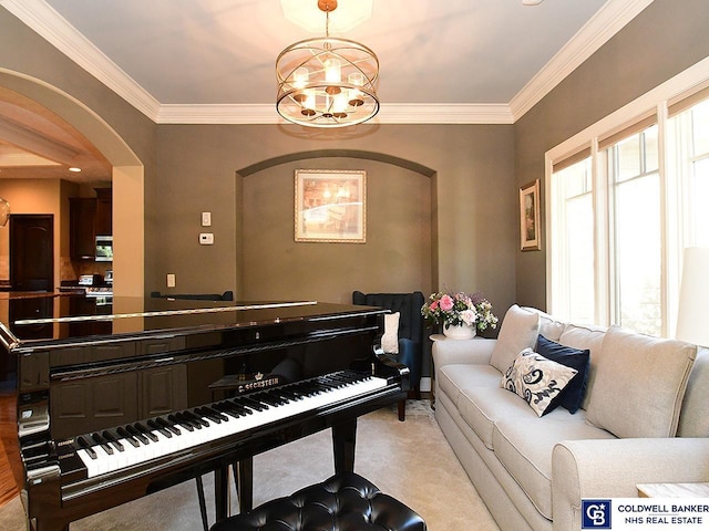 interior space with light carpet, a chandelier, and crown molding