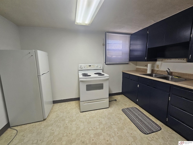 kitchen featuring white appliances, baseboards, blue cabinetry, a sink, and light countertops
