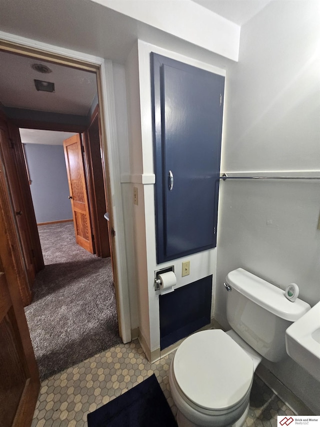 bathroom featuring toilet