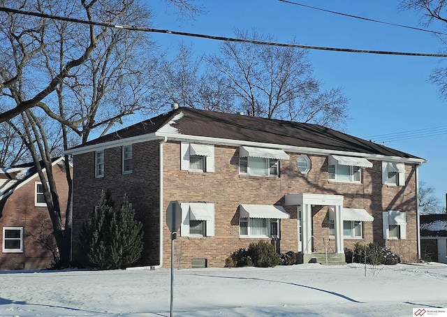 view of front of home with brick siding