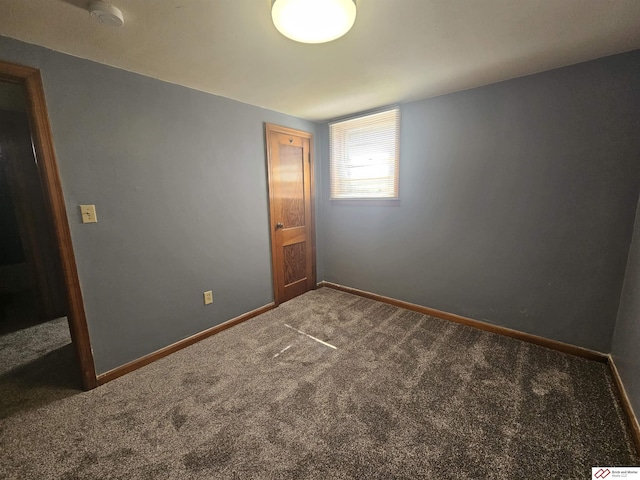 unfurnished bedroom featuring carpet flooring and baseboards