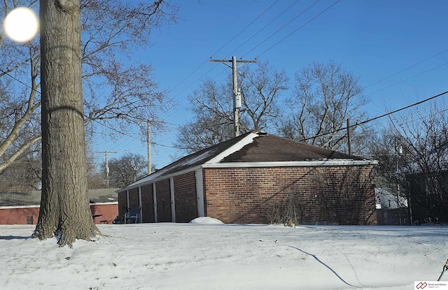 view of snow covered garage