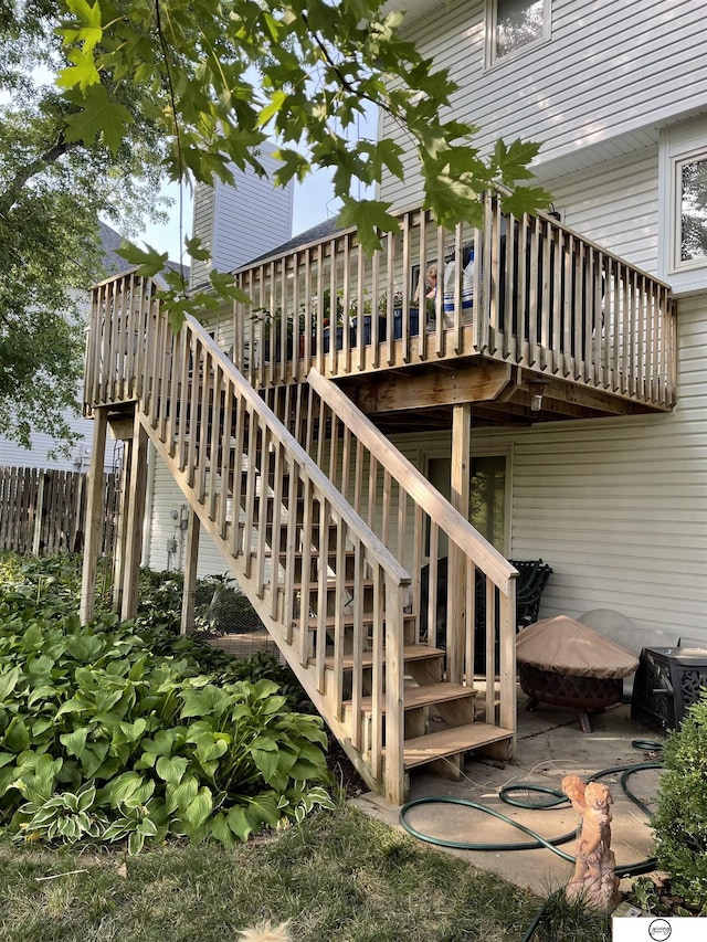 wooden terrace featuring a patio