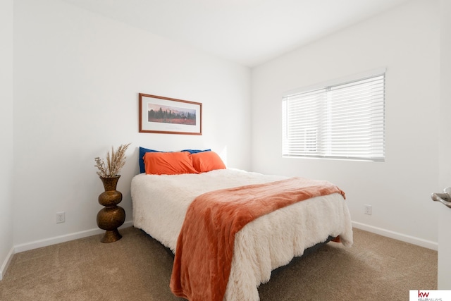 carpeted bedroom with baseboards