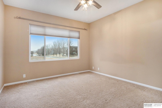 empty room with carpet flooring and ceiling fan