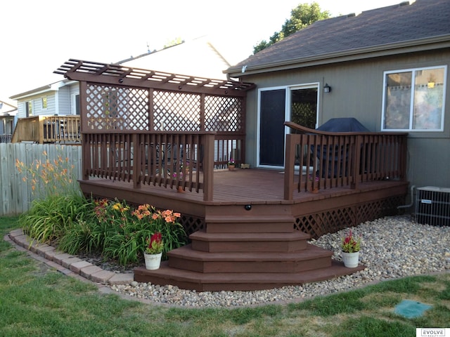 deck featuring central AC unit and fence