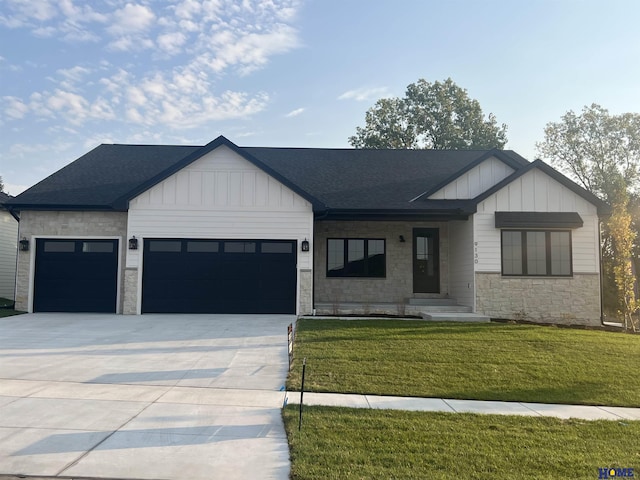 modern farmhouse style home with driveway, an attached garage, board and batten siding, and a front yard