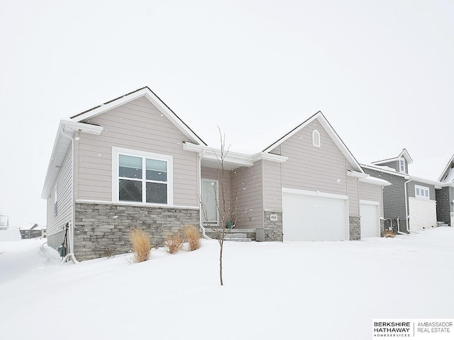 view of front of house with a garage and stone siding