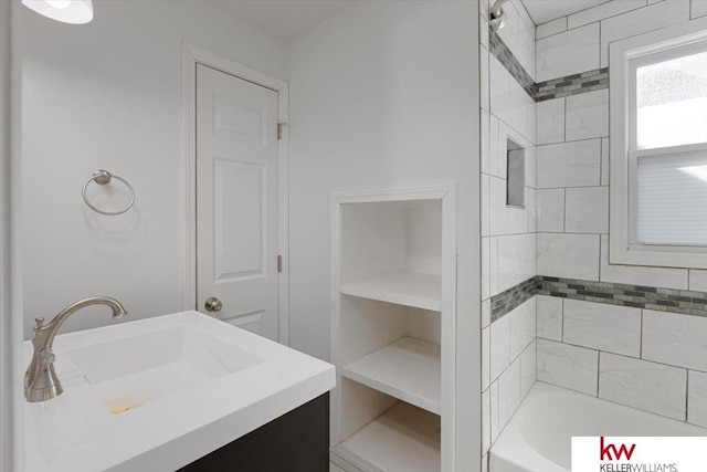 full bathroom featuring a closet, bathing tub / shower combination, and vanity