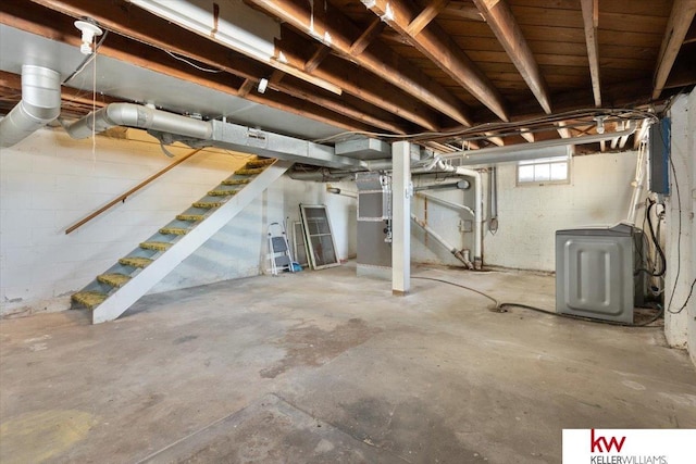 basement featuring washer / clothes dryer and stairway