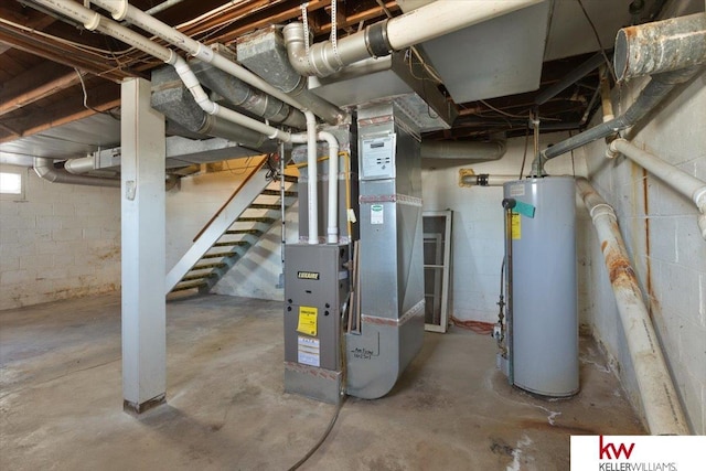 utility room with heating unit and water heater