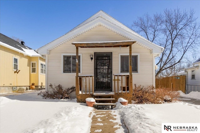 view of front of home with fence