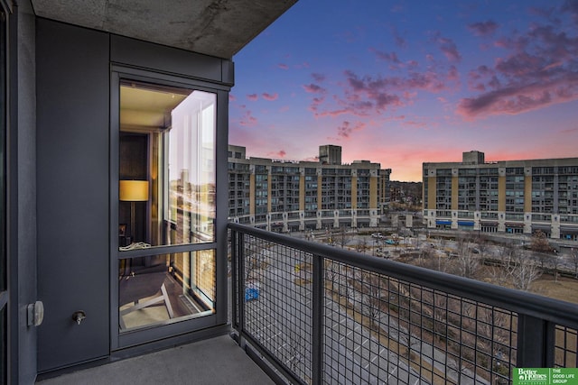 balcony at dusk with a city view