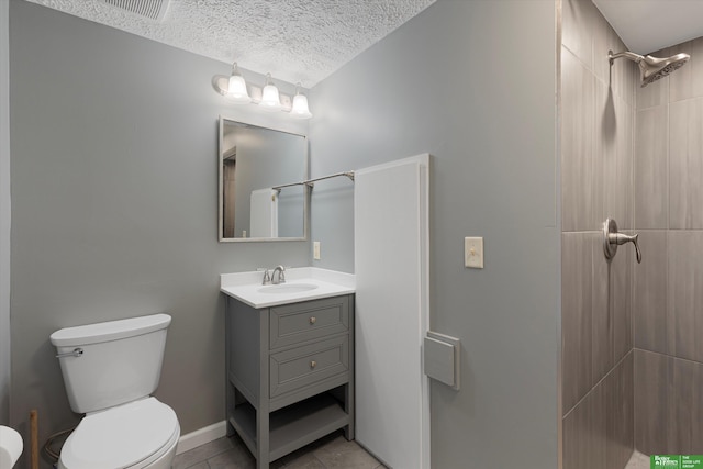 full bath with visible vents, toilet, a textured ceiling, vanity, and tile patterned flooring