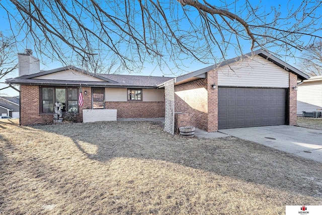 ranch-style home with a garage, driveway, a front lawn, and brick siding