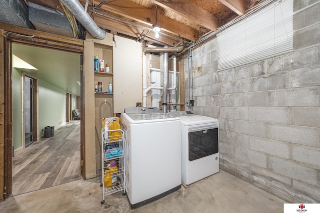 laundry room featuring laundry area and washing machine and clothes dryer