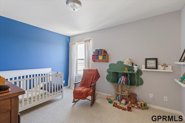 carpeted bedroom featuring baseboards