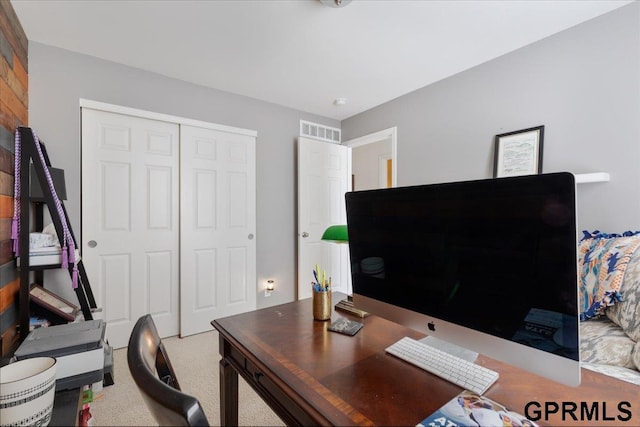 office space with carpet floors and visible vents