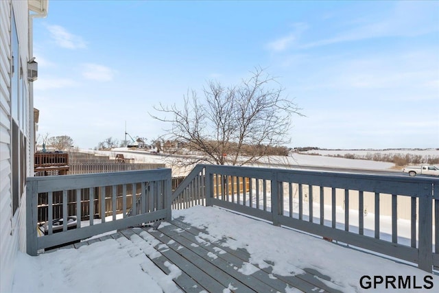 view of snow covered deck