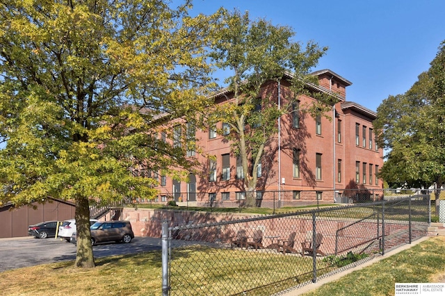 view of property with fence