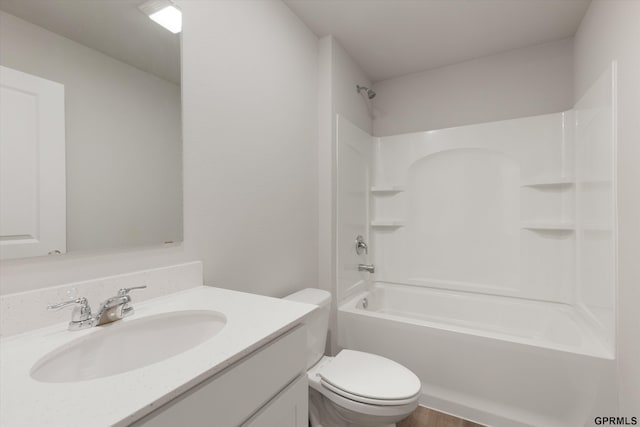 full bathroom with shower / washtub combination, vanity, and toilet