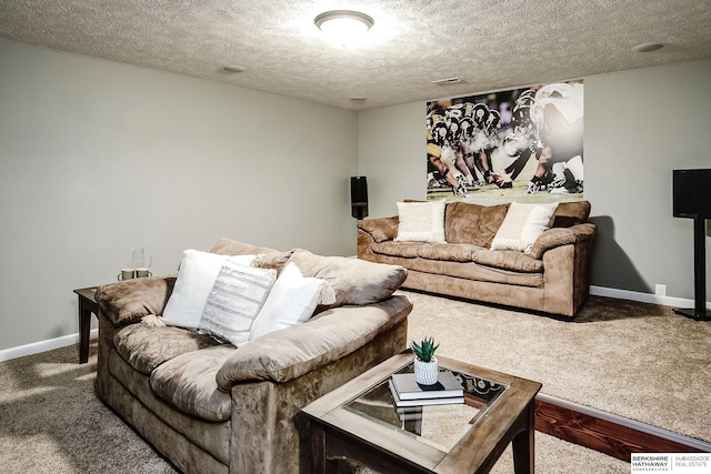 carpeted living room with a textured ceiling and baseboards